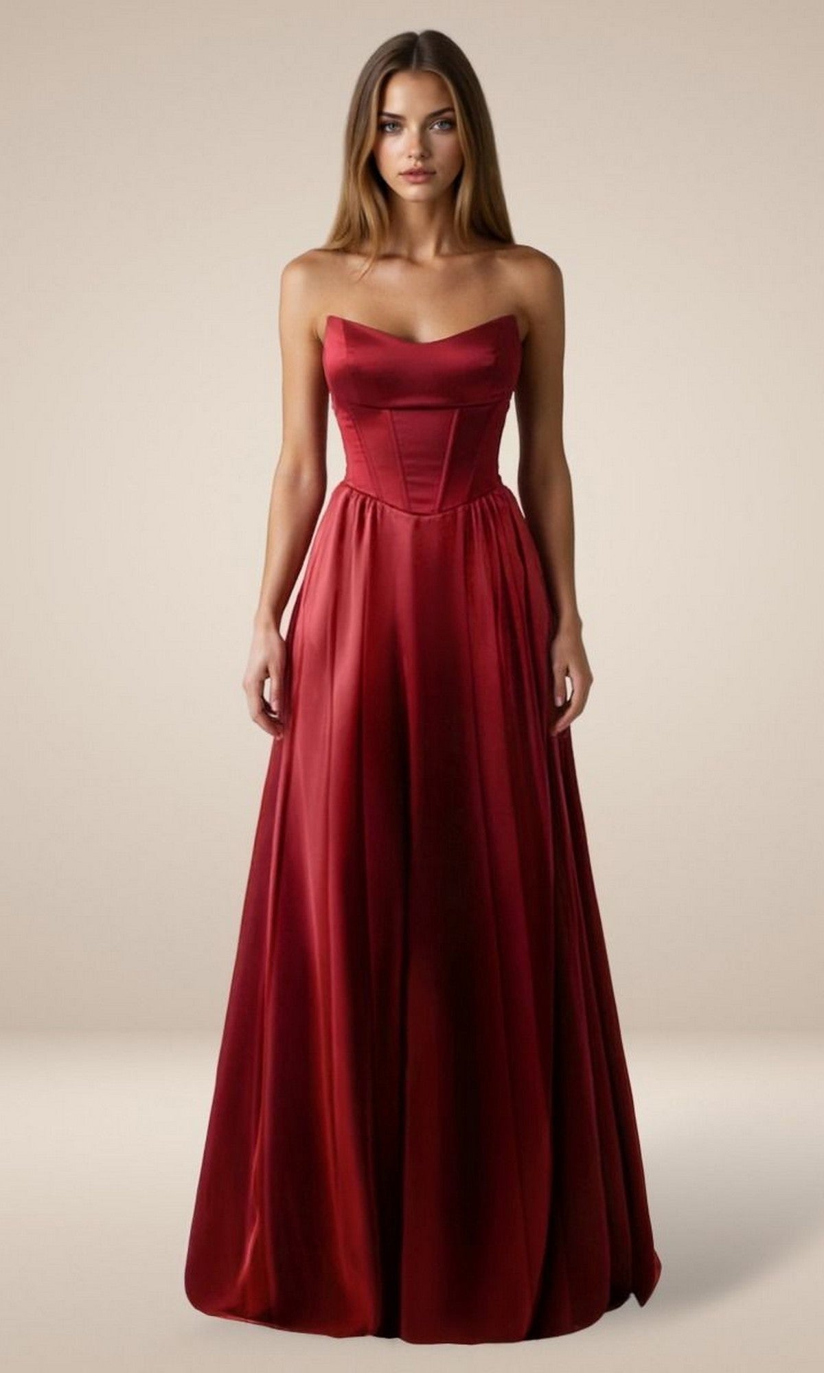A woman wears the Simple Strapless Long Prom Dress: Amoris T612, a red satin gown with a fitted bodice and flared A-line skirt, standing against a plain beige background.
